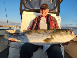 Dickie with 50-pound striped bass