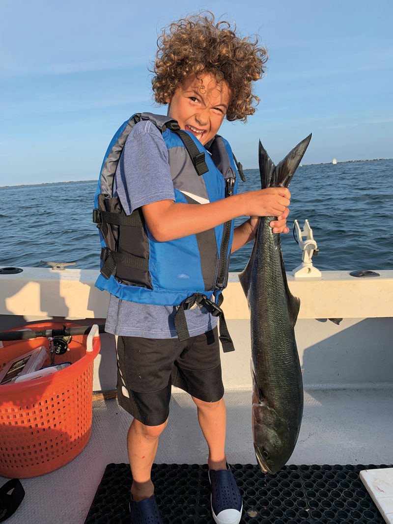 youth with bluefish